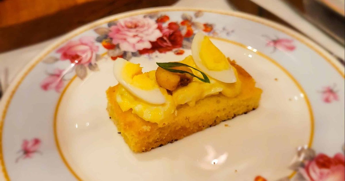 A close-up of egg salad served over sweet cornbread at Afternoon Spring Tea, Ritz Carlton Atlanta.