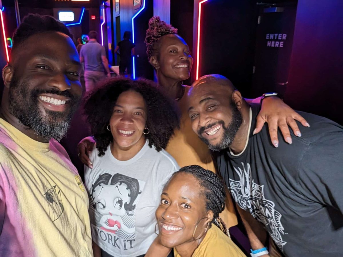 Group selfie inside Activate Atlanta's gaming area