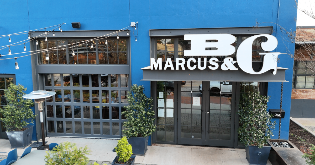 The welcoming front entrance of Marcus Bar & Grille in Atlanta, with its distinctive signage and modern facade.